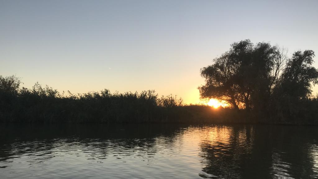 Sunset by the river at the Danube Delta